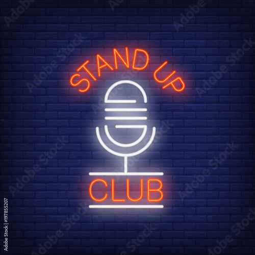 Stand up club neon sign. Microphone on brick wall background. Night bright advertisement. Vector illustration in neon style for comedy show