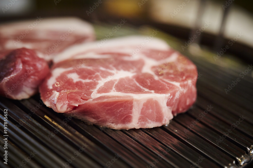 raw meat on grill raw meat on grill