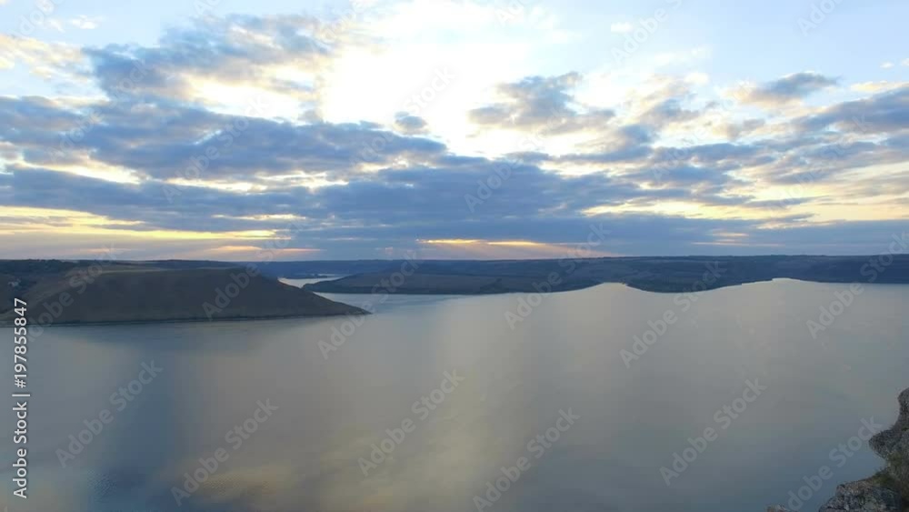 Great sunset on the lake between the mountains. A couple hugging at the edge of the cliff. 4k Great sunset on the lake between the mountains. A couple hugging at the edge of the cliff. 4k