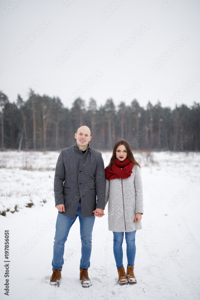 Couple in winter forest