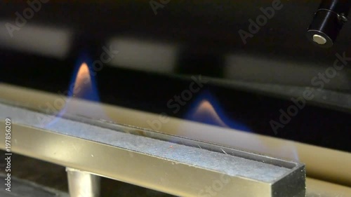 Modern bio fireplot fireplace on ethanol gas. Fireplace inside. Smart ecological alternative technologies. Contemporary biofuel on ethanol close-up. Energy saving innovation. photo