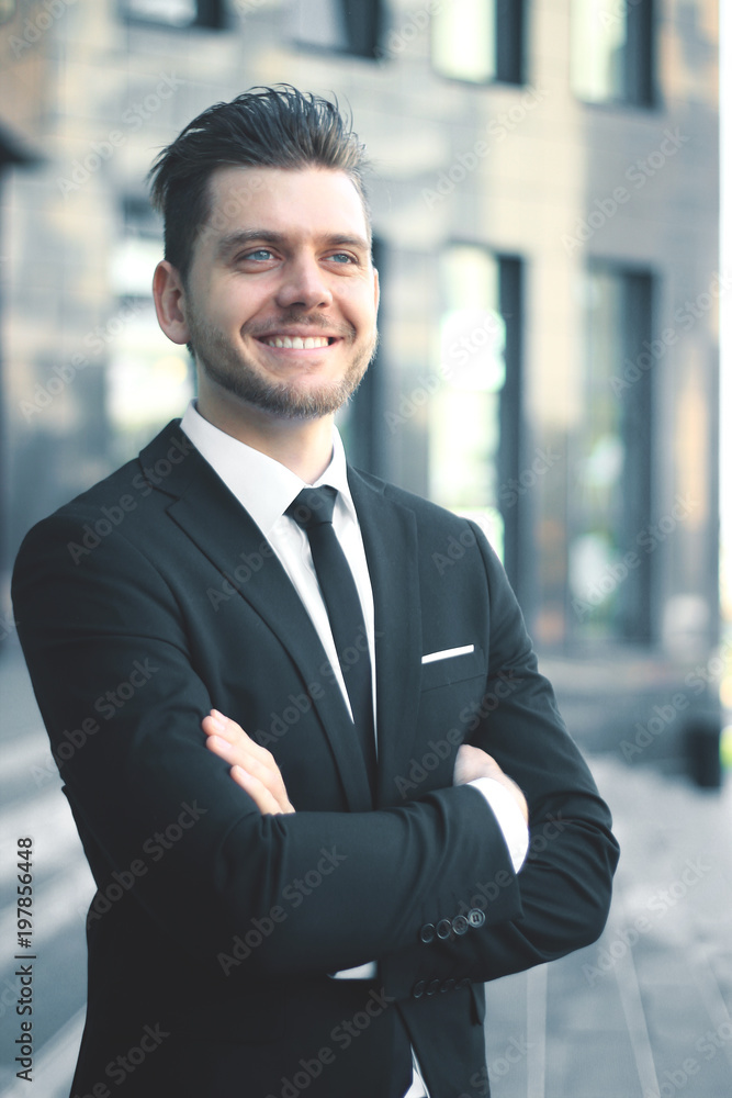portrait of a successful businessman on the background of an office building portrait of a successful businessman on the background of an office building