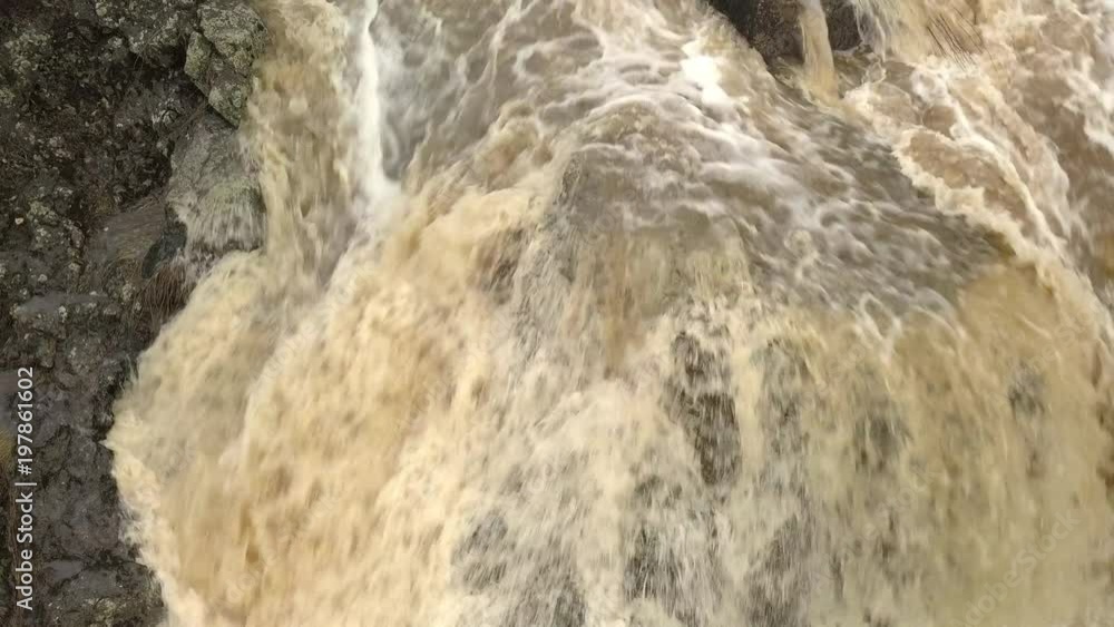 Rushing of water on the big rocks of the waterfalls Rushing of water on the big rocks of the waterfalls