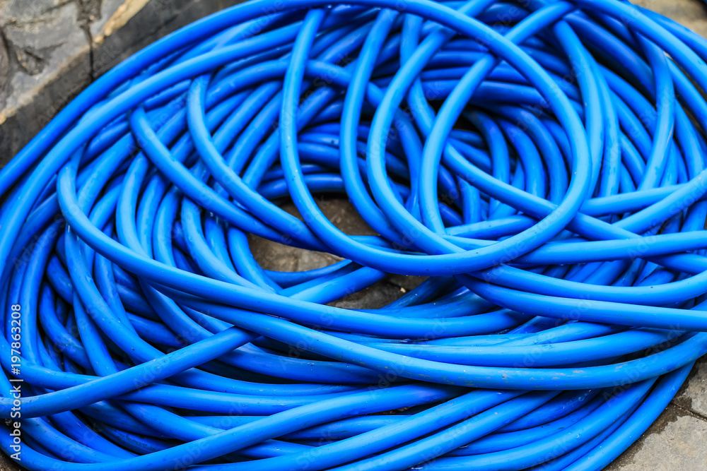 Close up on a blue garden hose Close up on a blue garden hose
