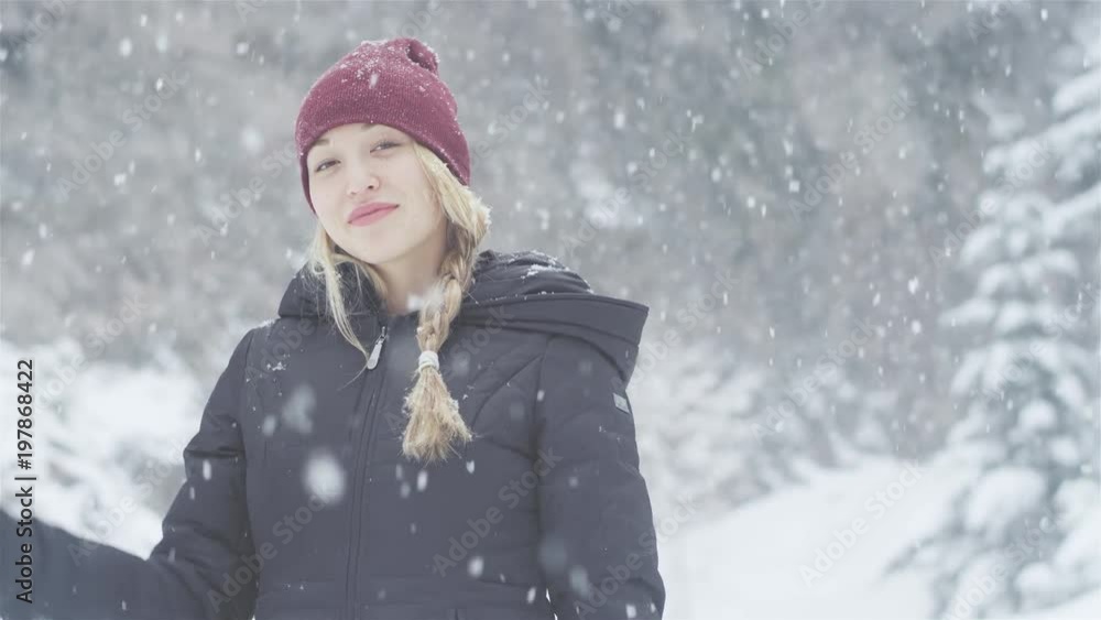 Portrait shot of a beautiful young Asian woman smiling on a snowy day Portrait shot of a beautiful young Asian woman smiling on a snowy day