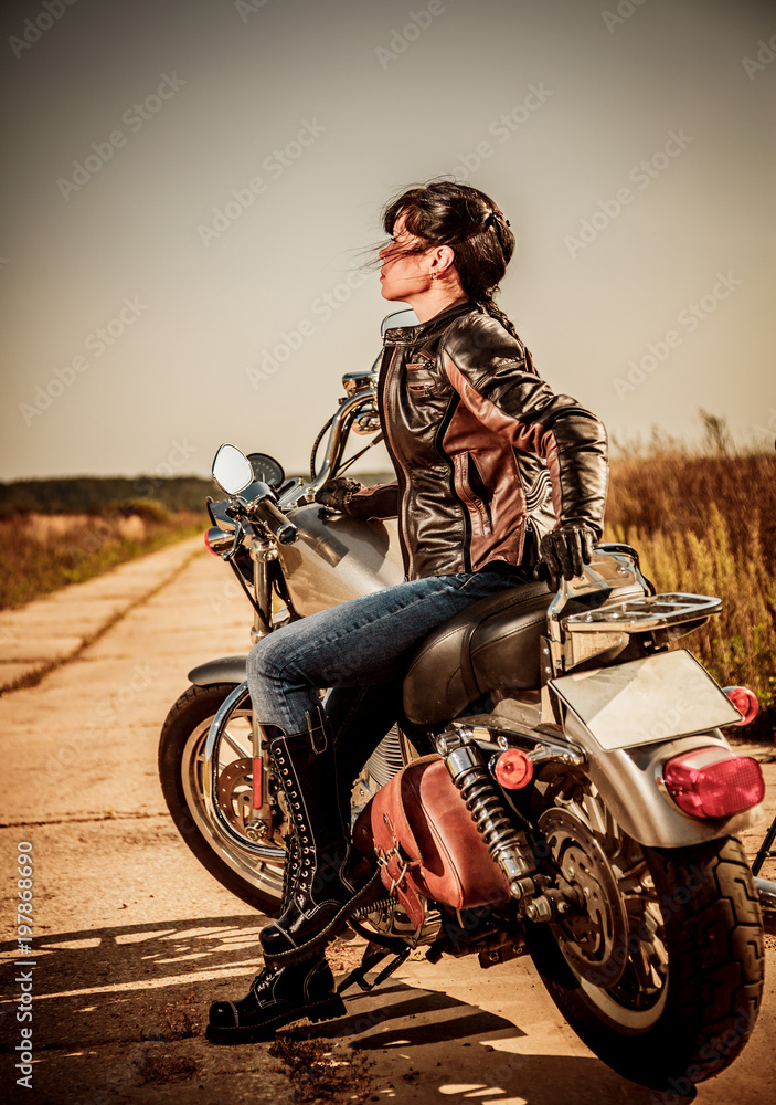 Naklejka premium Biker girl on a motorcycle