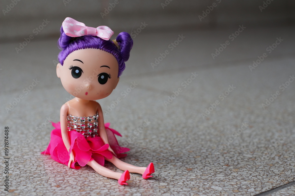 Toy doll baby girl seating on ground Toy doll baby girl seating on ground