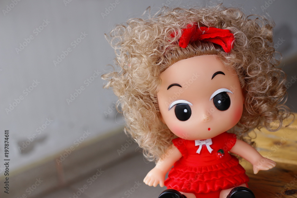 Toy doll baby girl seating on ground Toy doll baby girl seating on ground