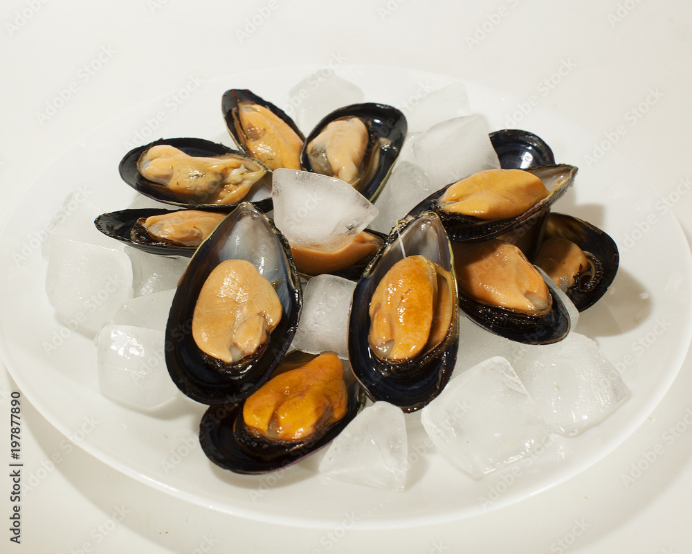 Mussels cooked in leaves on a white background. Mussels cooked in leaves on a white background.