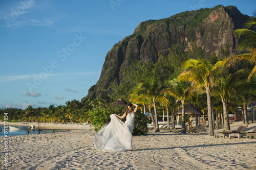 Photography Beautiful bride in white dress on the beach