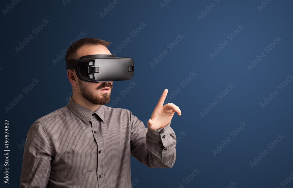 Amazed businessman with virtual reality goggles Amazed businessman with virtual reality goggles
