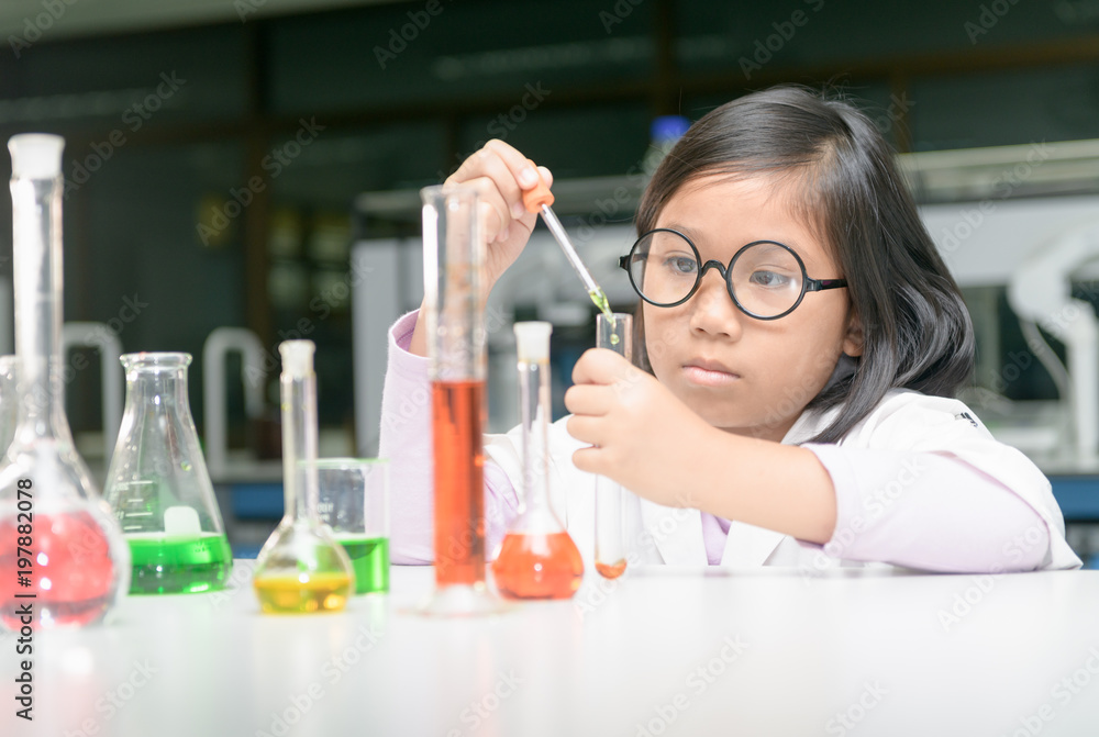 girl making experiment with test tube girl making experiment with test tube