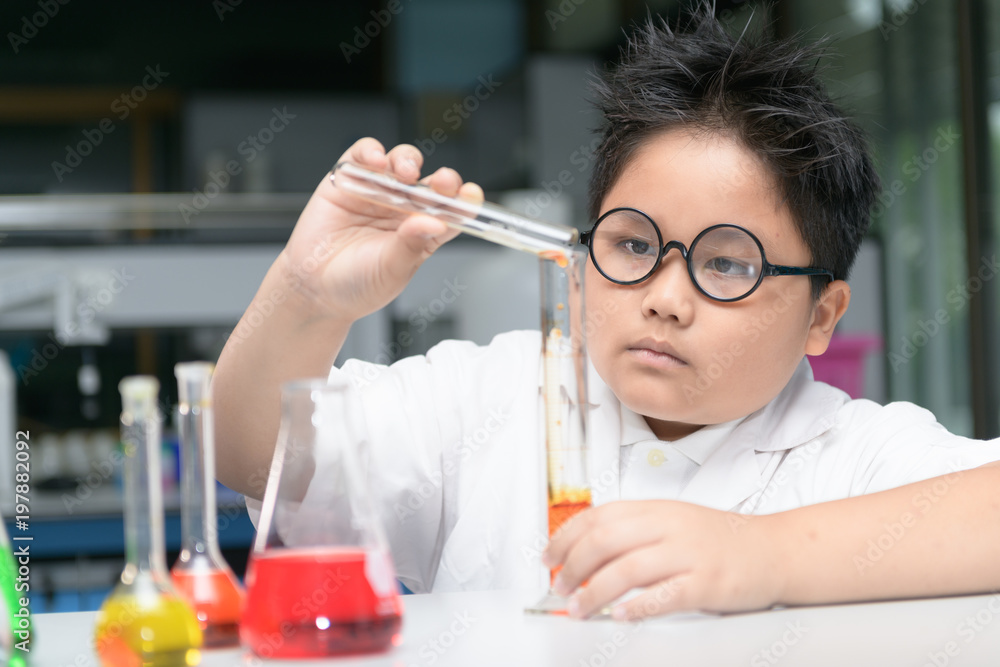 cute boy making experiment with test tube cute boy making experiment with test tube