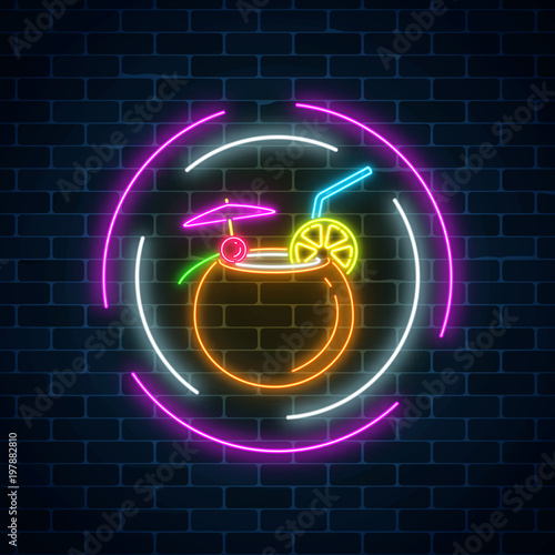 Glow neon sign of cocktails bar on dark brick wall background. Glowing gas advertising with alcohol shake in coconut.
