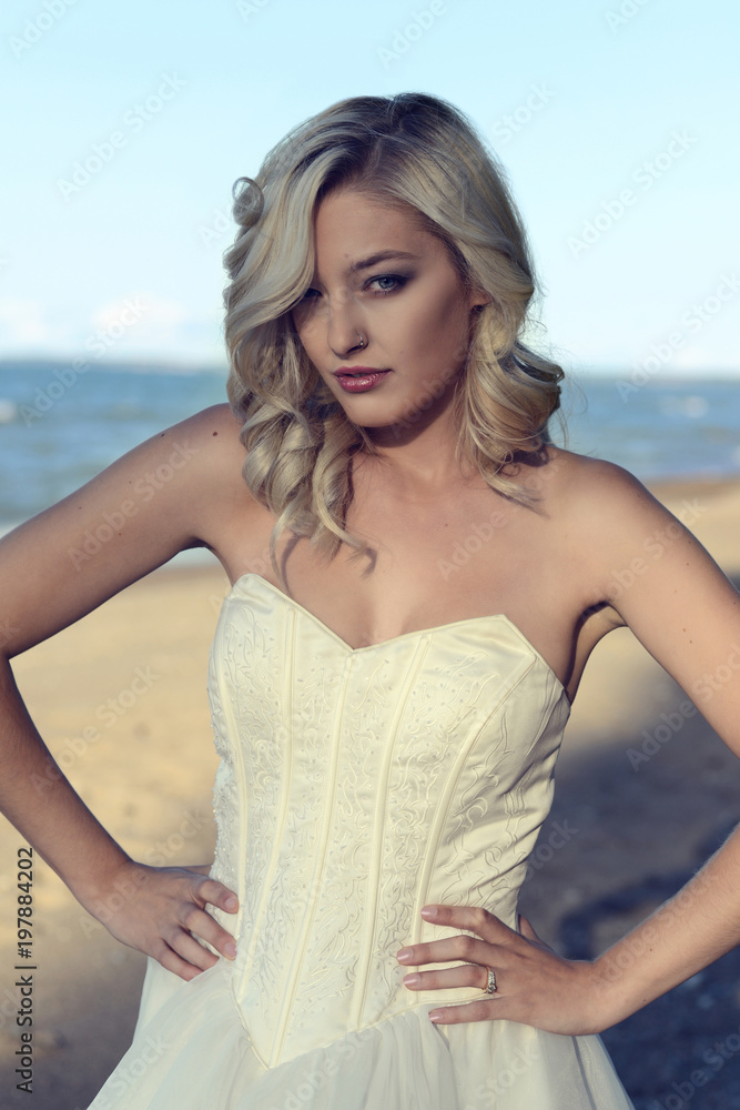 portrait of woman wearing corset dress at the beach