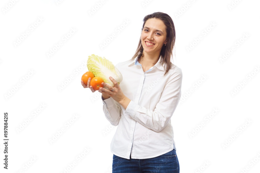 A happy family. Mother are holding vegetables. Vegetarian food Peking cabbage and tomatoes. A happy family. Mother are holding vegetables. Vegetarian food Peking cabbage and tomatoes.