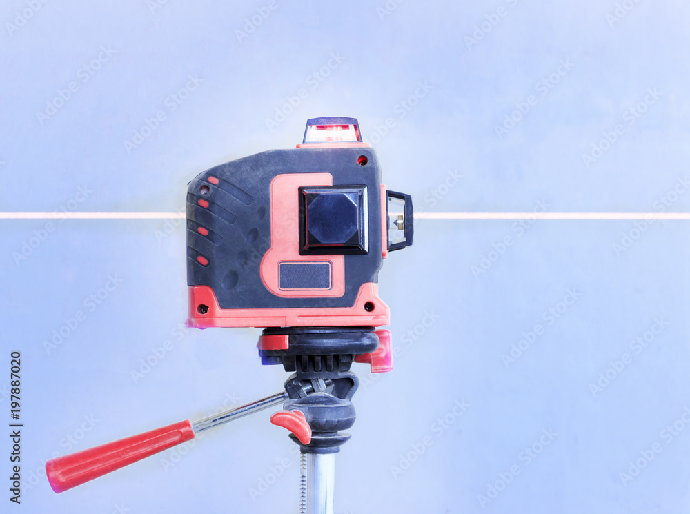 With a laser at the construction site. Close-up With a laser at the construction site. Close-up