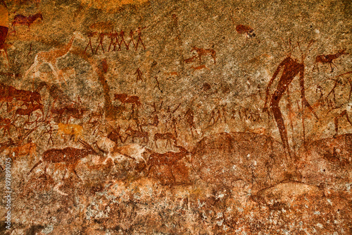 Bushmen rock painting of human figures and antelopes, giraffe of the Matopos National Park, Zimbabwe photo