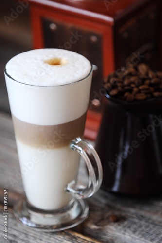 Fototapeta Naklejka Na Ścianę i Meble -  Delicious fresh latte coffee on wooden table 