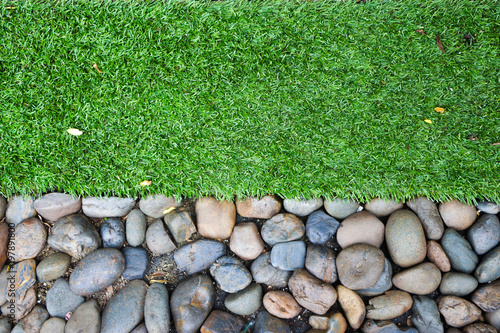Artificial grass and stone floor