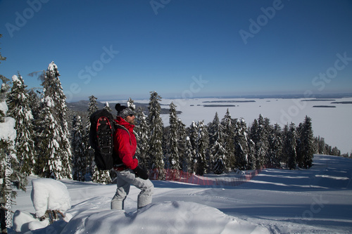 Snowshoe hiker on the Koli enjoys the winter landscape photo