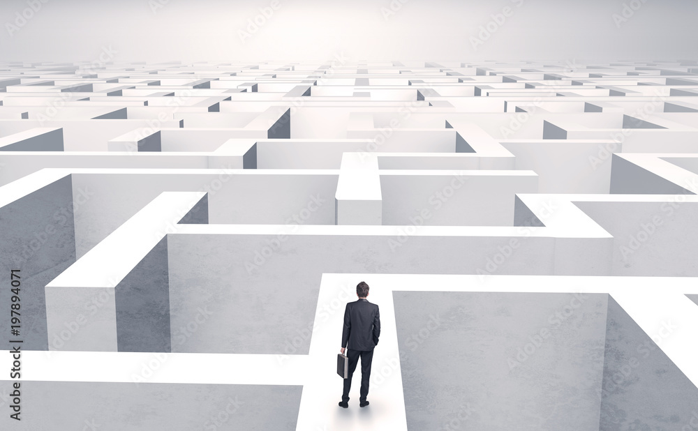 Small businessman in a middle of a huge maze
Small businessman in a middle of a huge maze