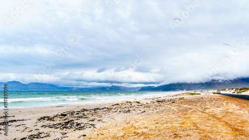 The beautiful beaches on False Bay along Baden Powell Drive between Macassar and Muizenberg near Cape Town, South Africa photo