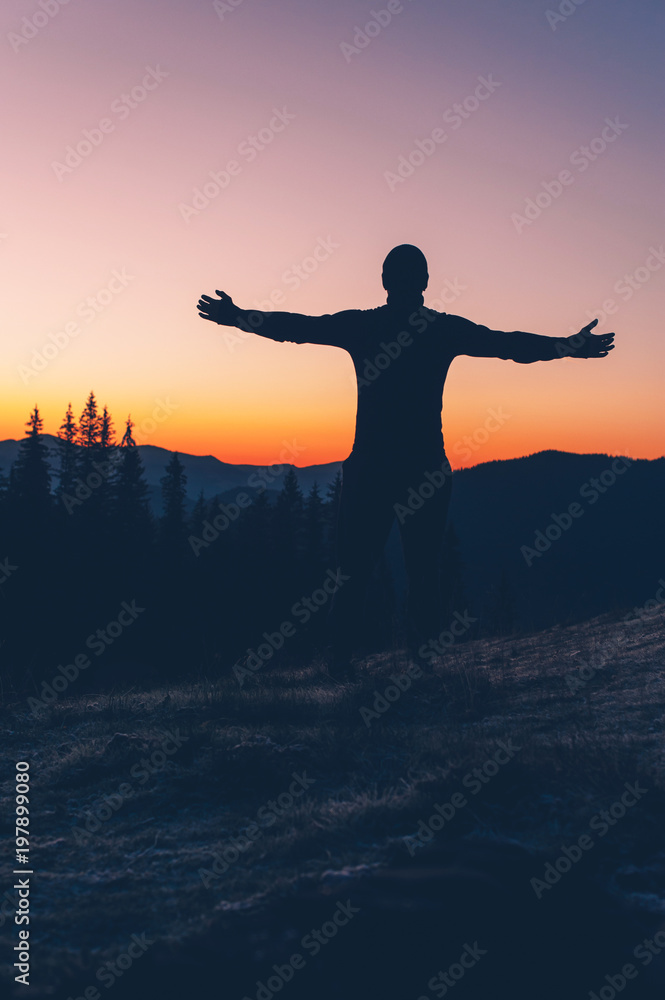 Fototapeta premium Man as a silhouette in the sunset