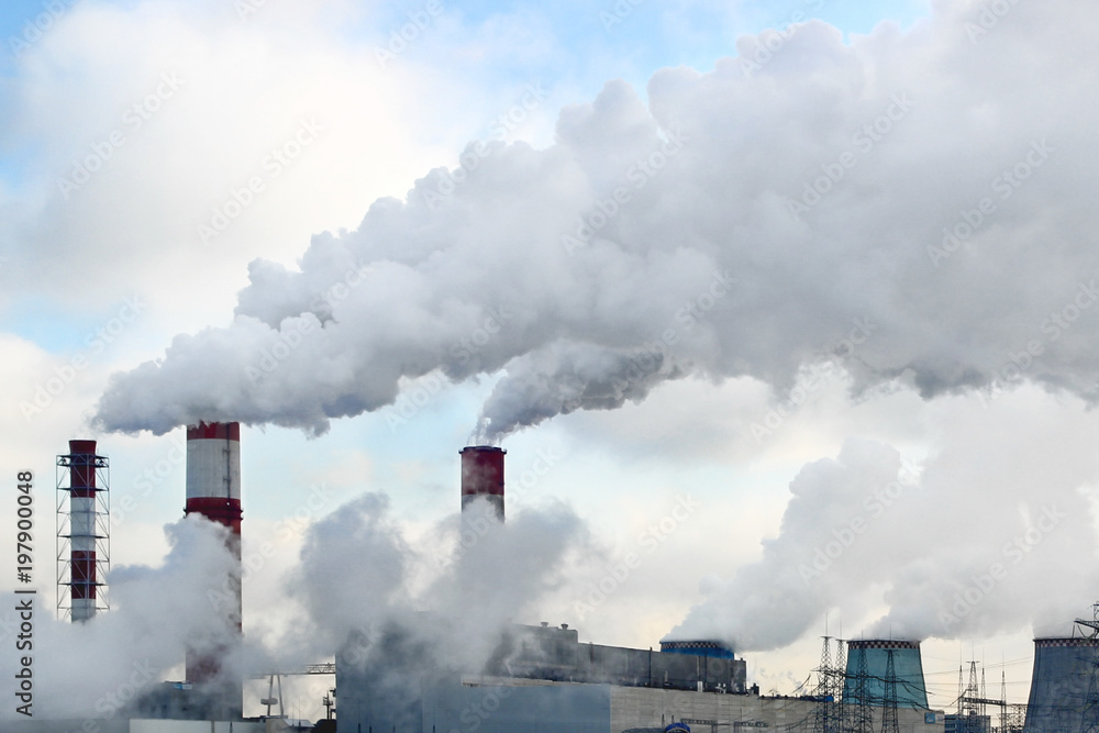 thermal power station. Smoke, steam from industrial pipes, ecology, air pollution. Nuclear power plant.