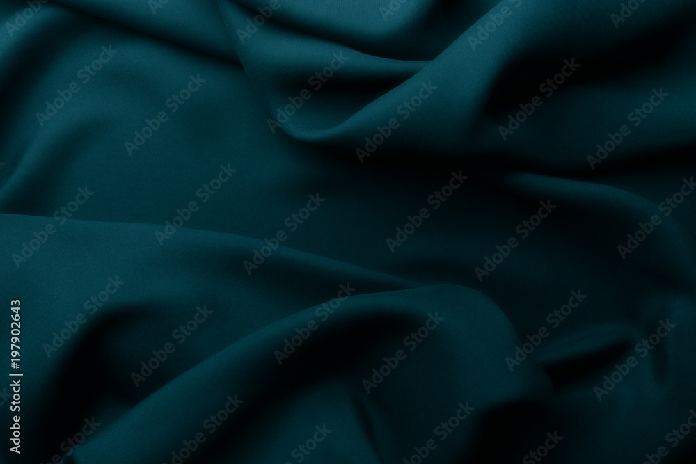 Fototapeta premium Elegant blue satin silk with waves, abstract background.
