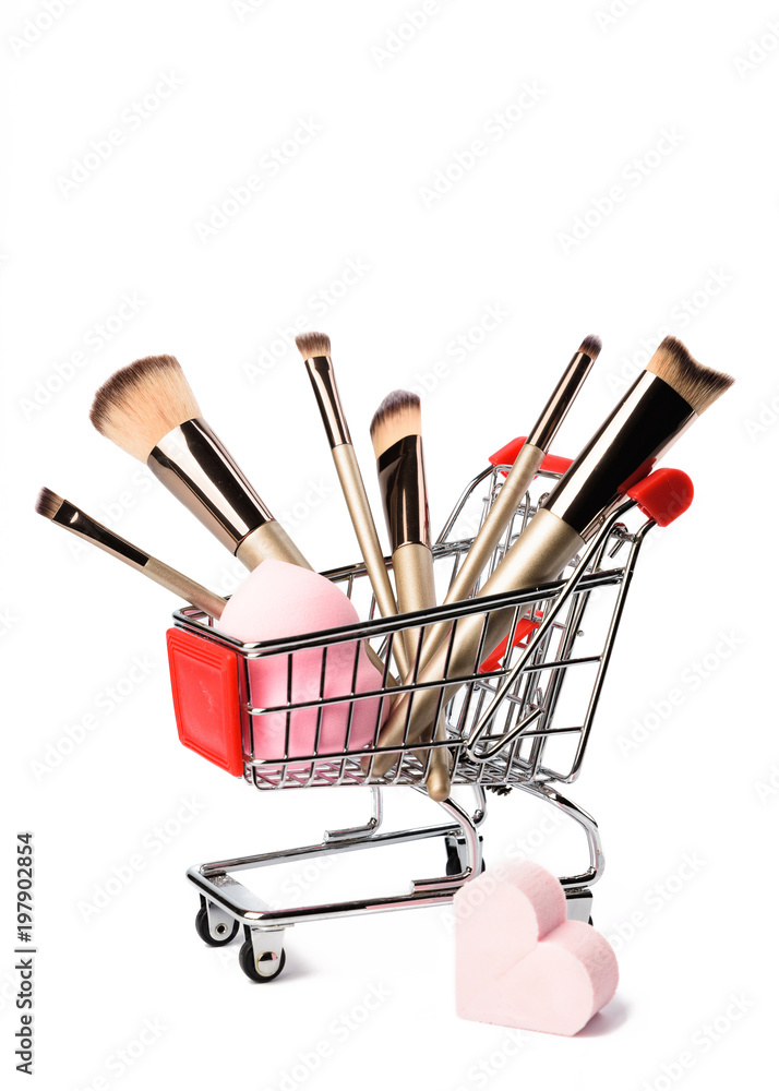 Set of makeup brushes on white background. Cosmetic, beauty blender and a  beautiful spring flowers. Online shopping concept. Stock Photo | Adobe Stock