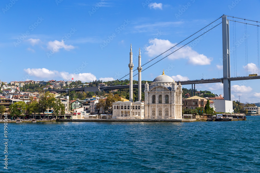 Istanbul, Turkey. Ortaköy Mosque (Great Medjidie Mosque, 1853-1854) against the background of the Bosphorus Bridge