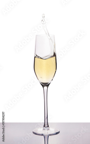 champagne in wineglass on white