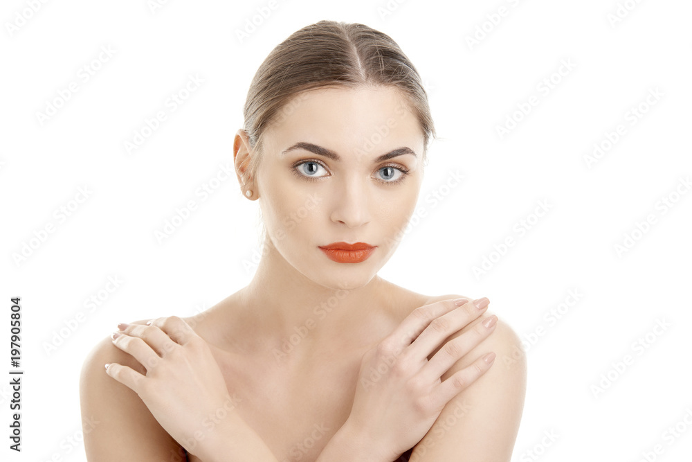 Close-up of beautiful young woman with red lips looking at camera while posing at isolated white background. Beauty shot in studio. Close-up of beautiful young woman with red lips looking at camera while posing at isolated white background. Beauty shot in studio.