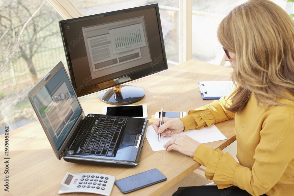 Businesswoman working at office desk Businesswoman working at office desk
