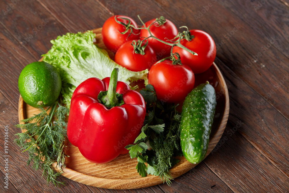 Close-up still life of assorted fresh vegetables and herbs on wooden rustic background, top view, selective focus. Close-up still life of assorted fresh vegetables and herbs on wooden rustic background, top view, selective focus.