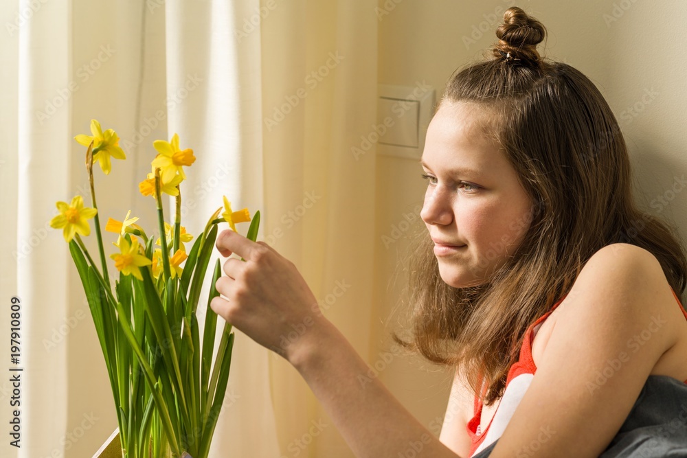 Teenage girl and bouquet of yellow spring flowers Teenage girl and bouquet of yellow spring flowers