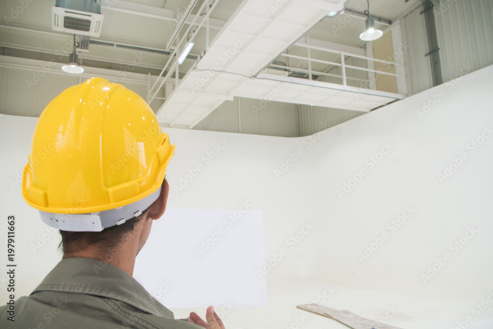 Engineer look at construction room Engineer look at construction room
