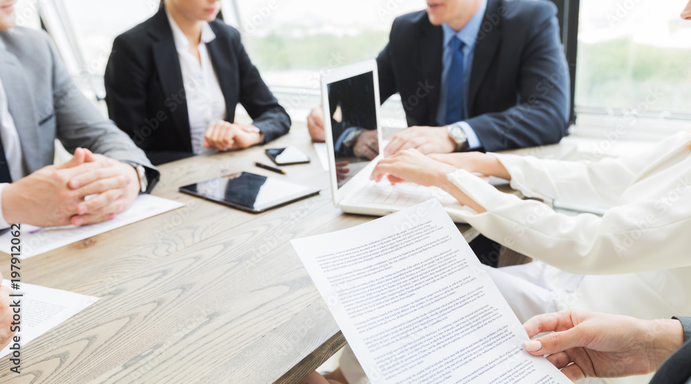 Business people discussing contract