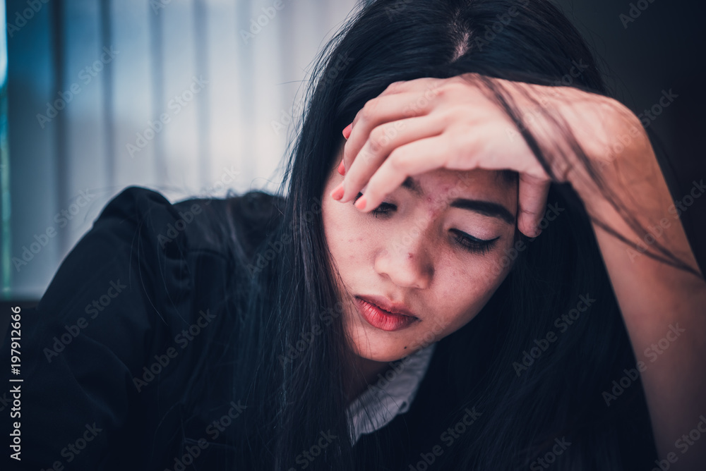 Close up sad woman in the office,stress girl from hard work,Heartbreak from boyfriend,Thailand people Close up sad woman in the office,stress girl from hard work,Heartbreak from boyfriend,Thailand people