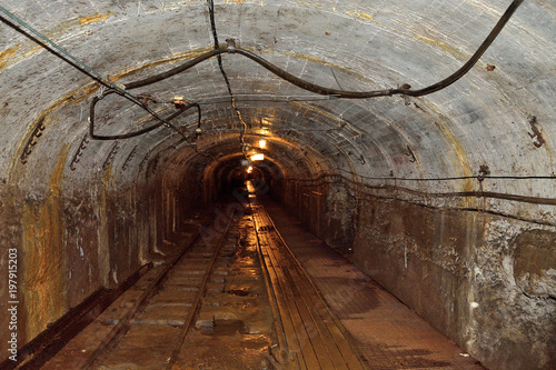 Long lighten tunnel through Oil shale mine photo