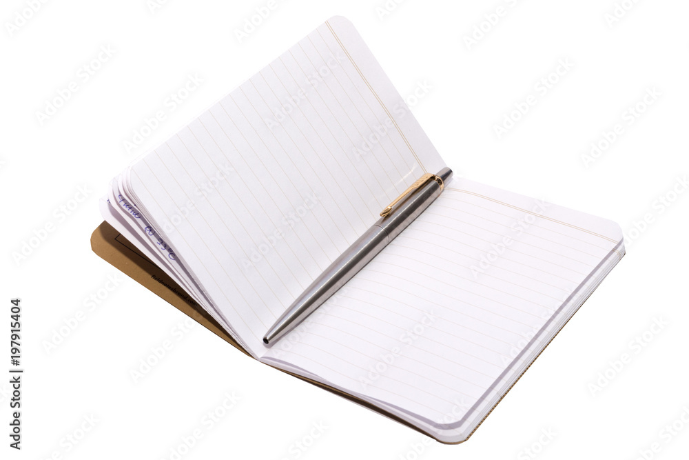 Memo book with a shiny stainless steel pen on it on a white backround Memo book with a shiny stainless steel pen on it on a white backround
