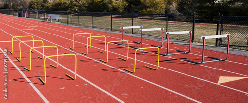 Hurdles set up for jumping practice on a track
