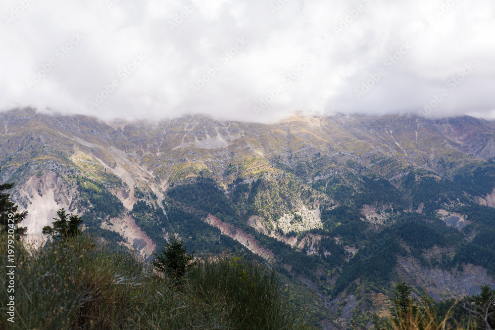 Panoramic view of mountain in National Park of Tzoumerka, Greece Epirus region. Mountain in the clouds