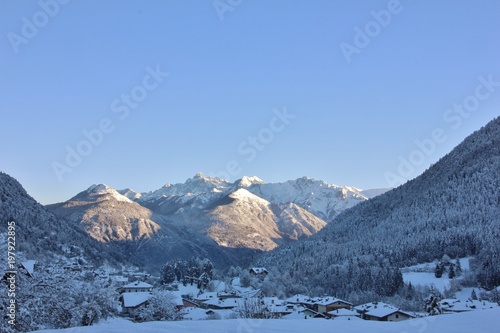 Alpine village of Bondo with Brenta Dolomites in the background, Trentino, Italy