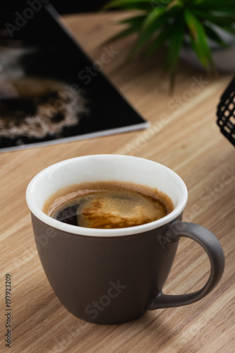 Hot americano coffee in gray cup on the table