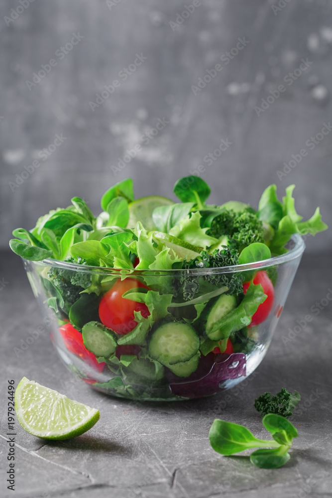 Fresh vegetable salad over textured grey background. The concept of organic vegetarian food. Copy space. Fresh vegetable salad over textured grey background. The concept of organic vegetarian food. Copy space.