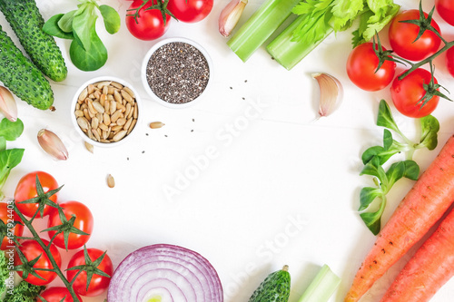 Top view of fresh vegetables over white background. Healthy and organic food frame. Flat lay.