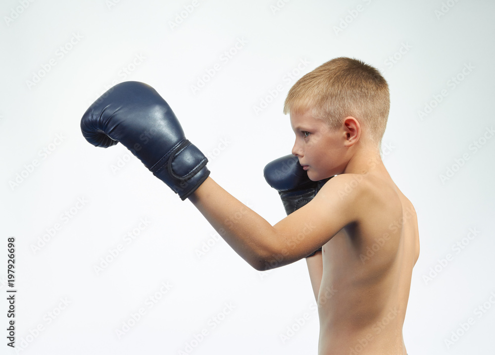 The athlete in boxing gloves beats left hand The athlete in boxing gloves beats left hand