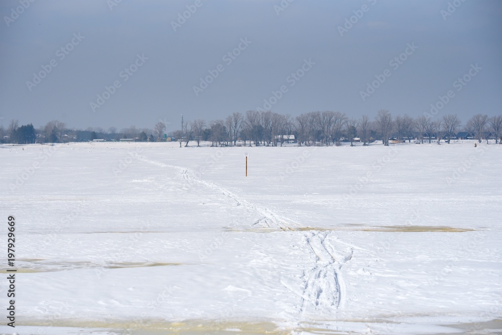 Skiing through a large river. Volga river. Samara city. Winter sunny day. Skiing through a large river. Volga river. Samara city. Winter sunny day.
